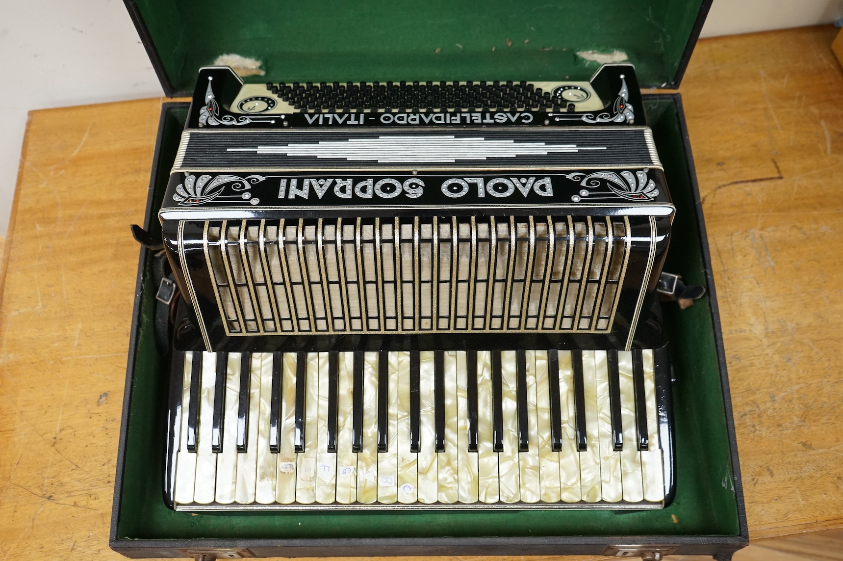 A cased Paolo Soprani Castelfidardo Italia piano accordion.